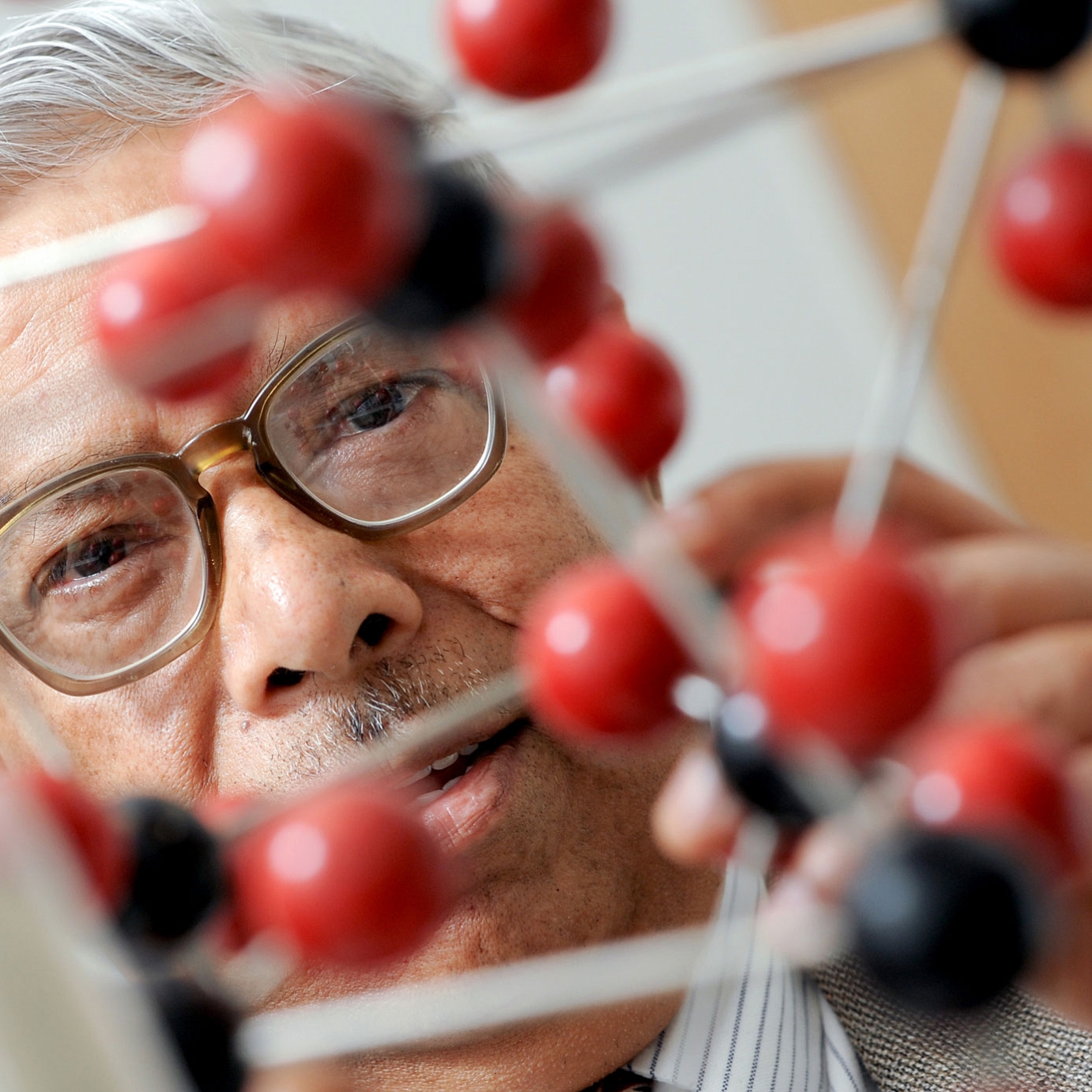 Man with molecular structure model