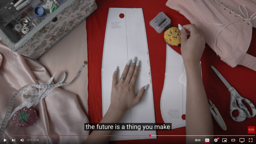 A translucent caption reading "the future is a thing you make" on a YouTube video.