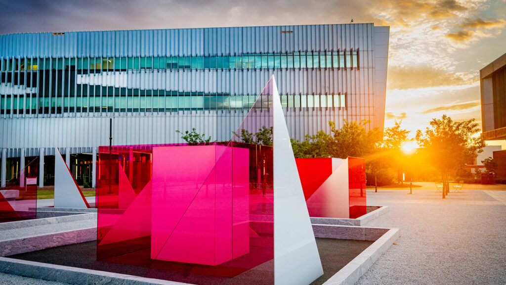 The Reds and Whites art exhibit on Centennial Campus at sunset.